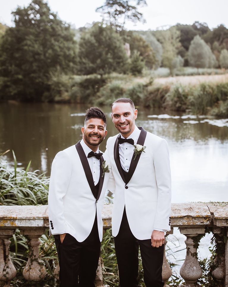 Braxted Park wedding with two grooms in matching white suit jackets