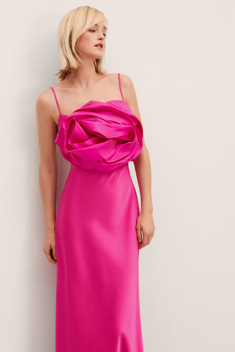 Pink wedding guest dress from Mango with satin material, maxi length and statement floral feature on chest