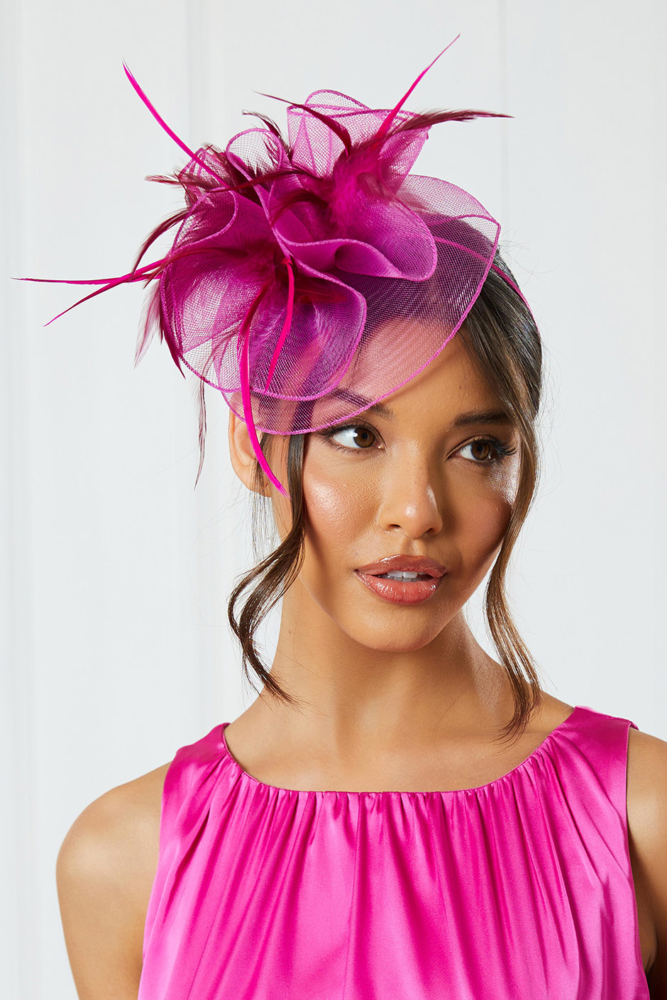 Pink fascinator for weddings from Quiz with feather detailing