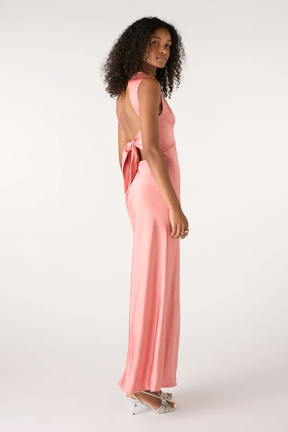 Pink peach bridesmaid dress from Omnes with maxi length and open tie back design 