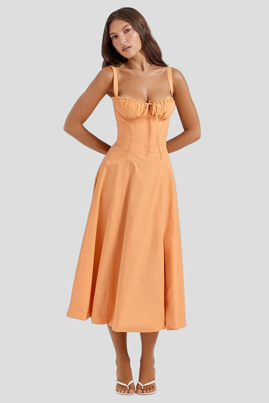 Orange peach bridesmaid dress from House of CB with gathered cup bodice and midi length 