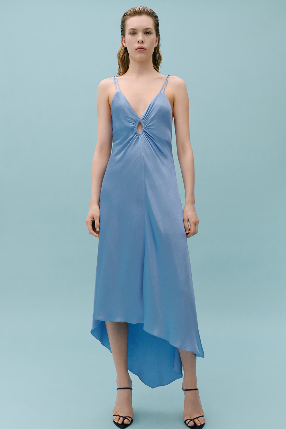 Pale blue satin asymmetrical dress from Mango in collaboration with Victoria Beckham as a summer wedding guest dress idea