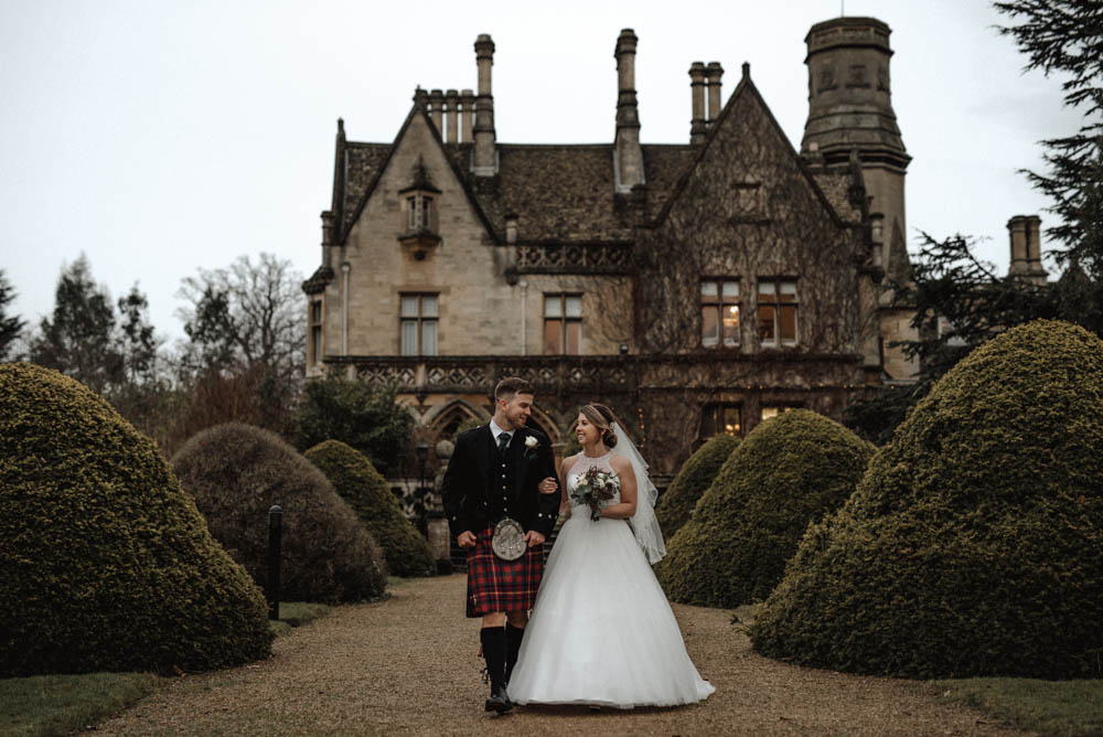 December Wedding at Manor by The Lake Country House in Gloucestershire with Kilts and Halterneck Wedding Dress