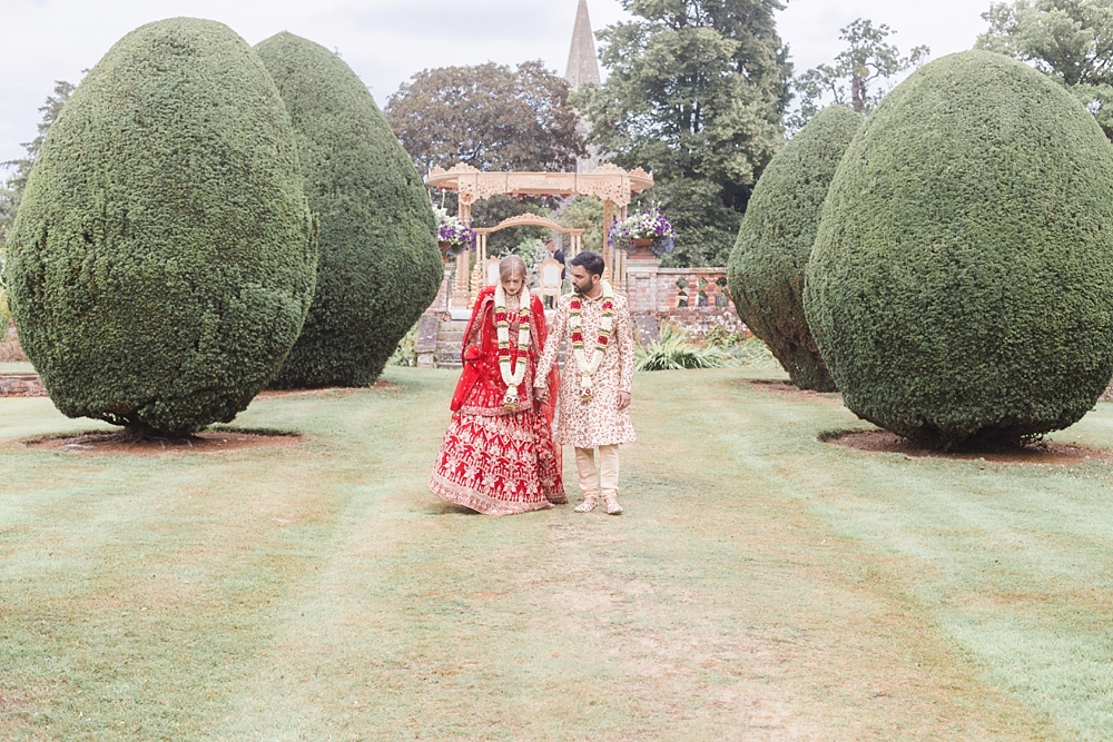 Hindu Wedding Ceremony At Fusion Celebration With Bright Flowers